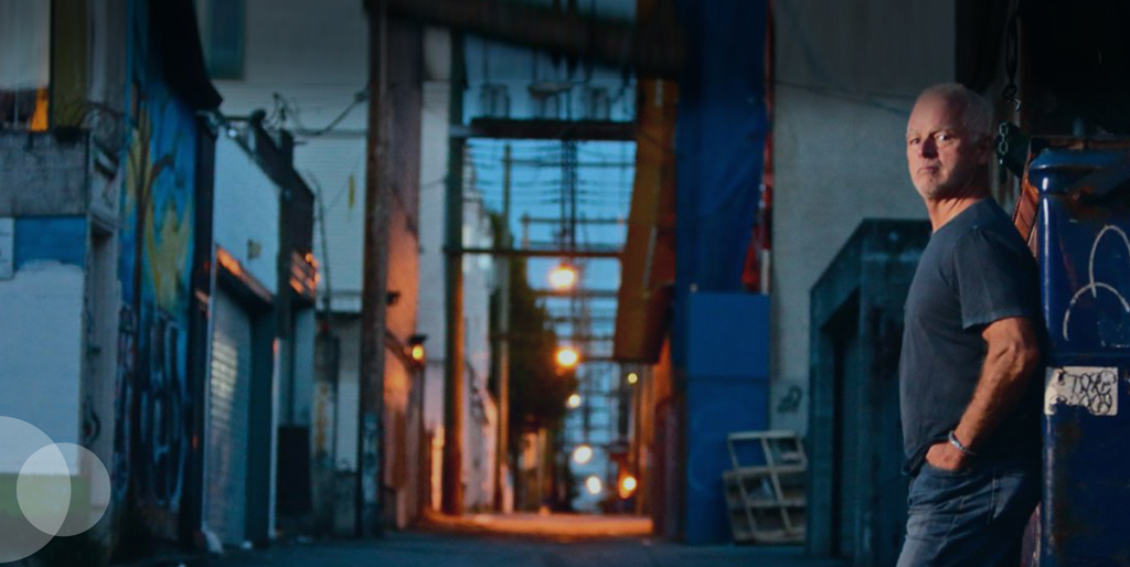 man in vancouver alleway