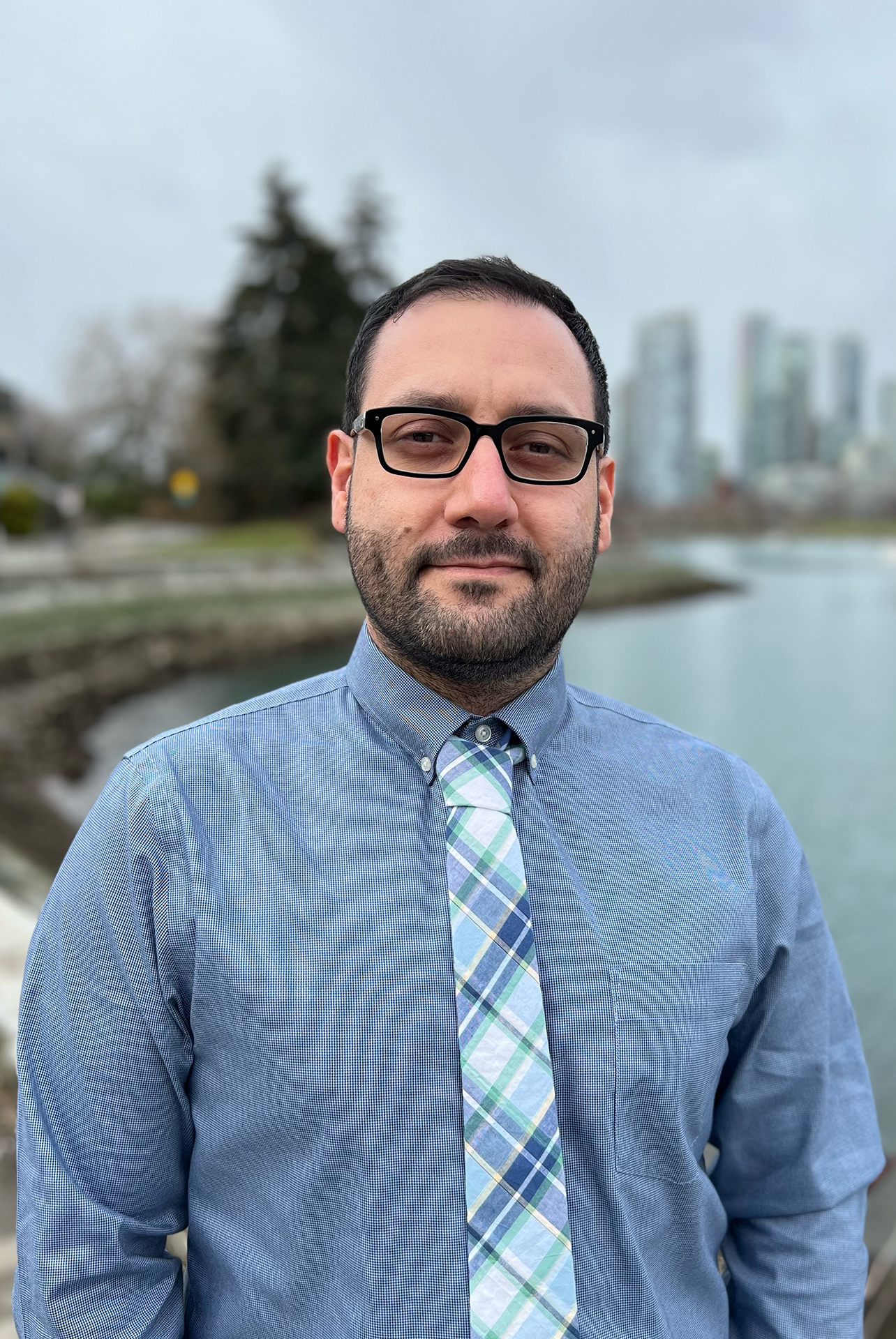 Mahyer standing on the seawall